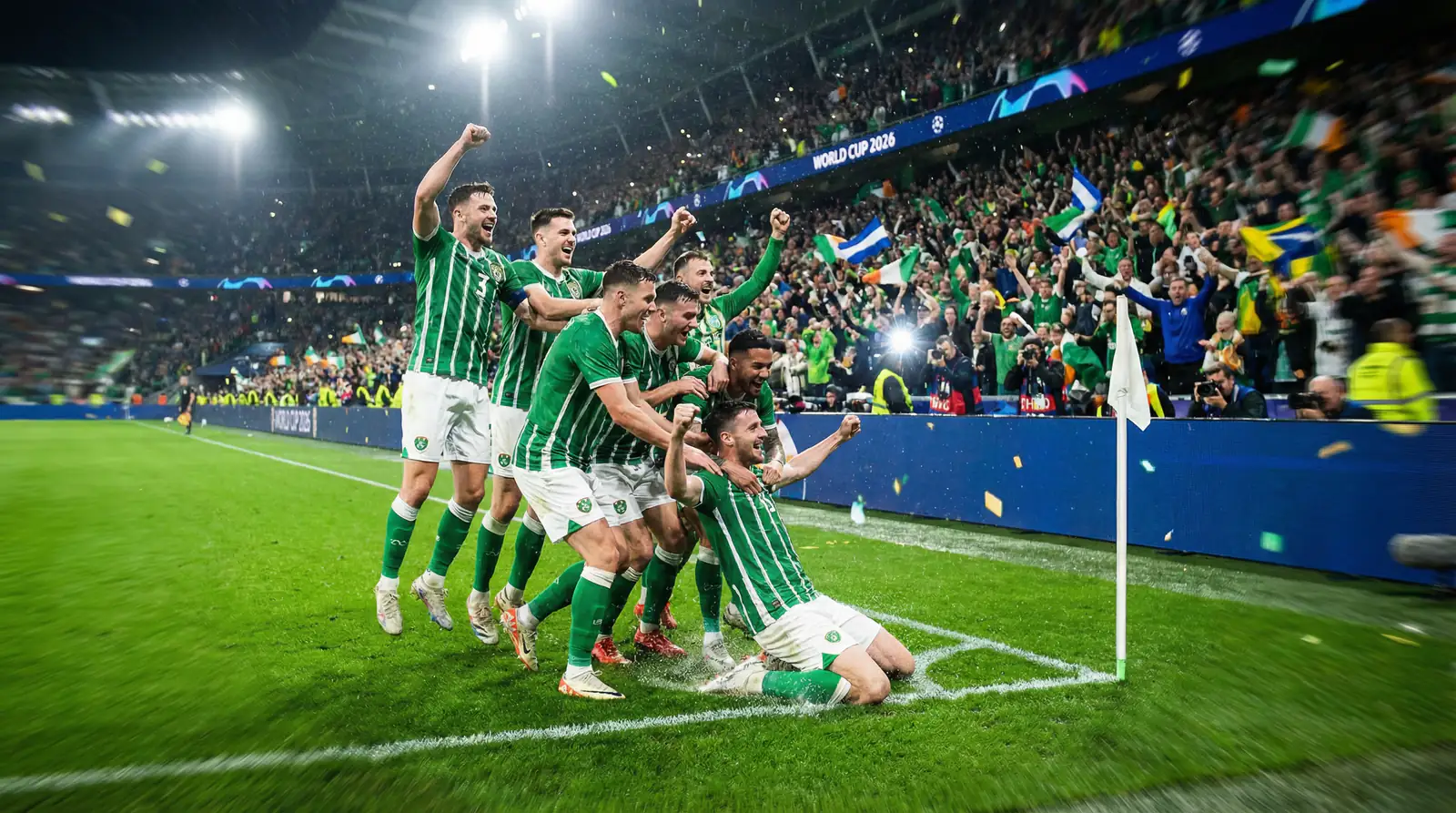 Underdog national football team players celebrating a World Cup 2026 upset victory on the pitch